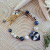 WHITE & BLUE SODALITE BRACELET WITH EVIL EYE CHARM