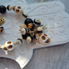 ORANGE & BLACK CLUSTER NECKLACE WITH SKULLS