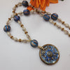 BOHO NECKLACE WITH ARTISAN CERAMIC SUN PENDANT