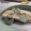 TURQUOISE CZECH GLASS TEAR DROP EARRINGS WITH STAR PATINA CHARMS